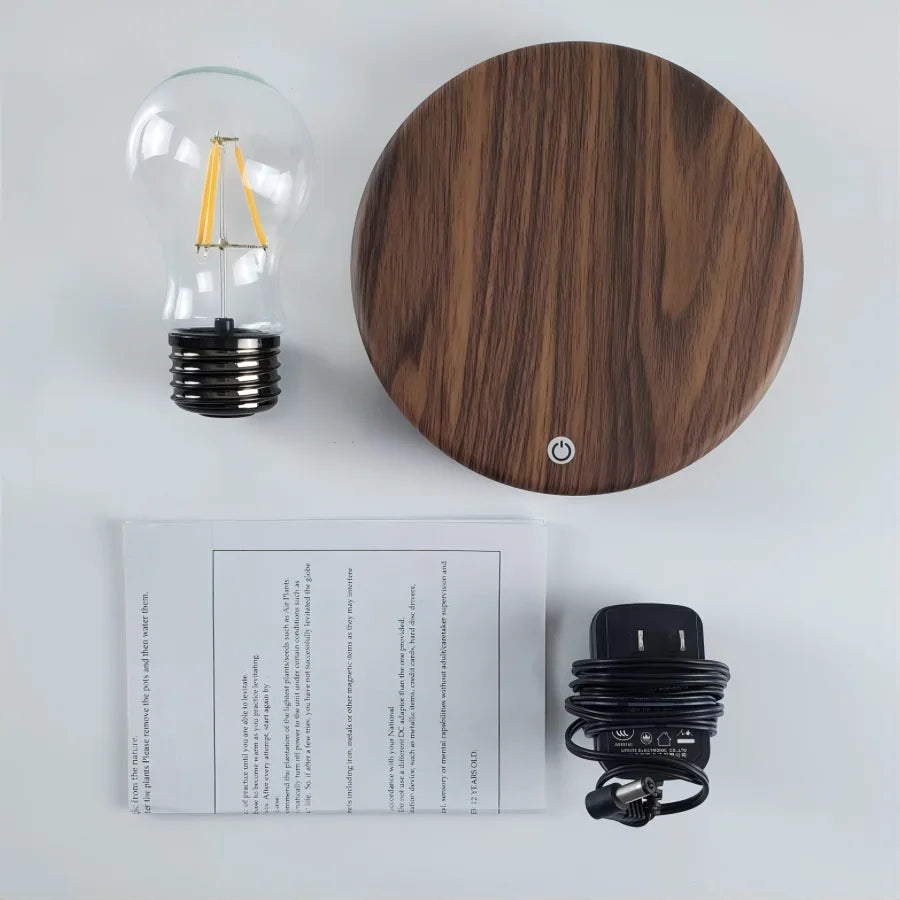 Lewitująca lampka LED w kształcie żarówki — magnetyczna lewitacja, podstawa z drewna | Norivo Norivo